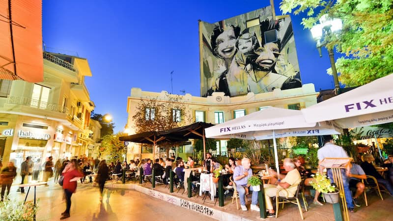 Time to revisit Athens! In the “rickety-chic” Psyrri neighborhood of Athens, you’ll find slick outdoor restaurants next to vibrant street art. CREDIT: Rick Steves.