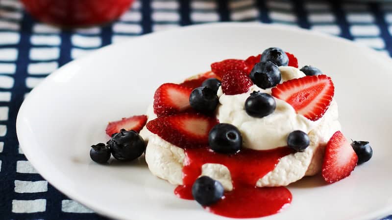 Mini Berry Pavlovas for a Patriotic Treat: This festive dessert is light yet decadent, full of fresh fruit and whipped cream.