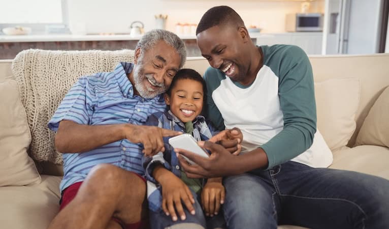 Three generations: granddad, dad, and little boy. Used in What's Booming June 13