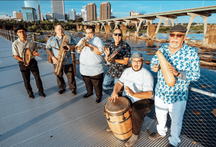 Kadencia band, with skyline of Richmond, Virginia, in the background. The musicians will be part of 804 Day music festival in RVA