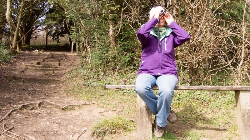 woman birder, who could be on a birding retreat. Image by Roy Pedersen