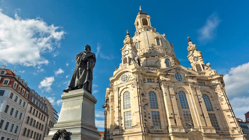 A statue of Protestant reformer Martin Luther looms large outside the lovingly rebuilt Frauenkirche, which had lain in ruins for nearly six decades since being destroyed in the Allied firebombing of historic Dresden in World War II. (Dominic Arizona Bonuccelli, Rick Steves‚Äô Europe)