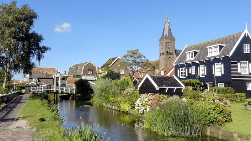 Less than an hour from Amsterdam, the traditional fishing village of Marken, with its unique architecture, is a time-warp trip into old Holland. It is one of three picturesque day trips from Amsterdam. CREDIT: (Rick Steves, Rick Steves’ Europe).