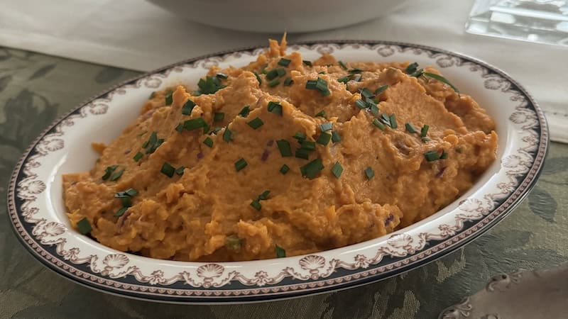 Mashed sweet potatoes with guajillo chile powder demonstrate the power of pairing chile and sweet potatoes.