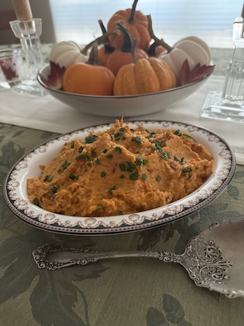 Mashed sweet potatoes with guajillo chile powder demonstrate the power of pairing chile and sweet potatoes.