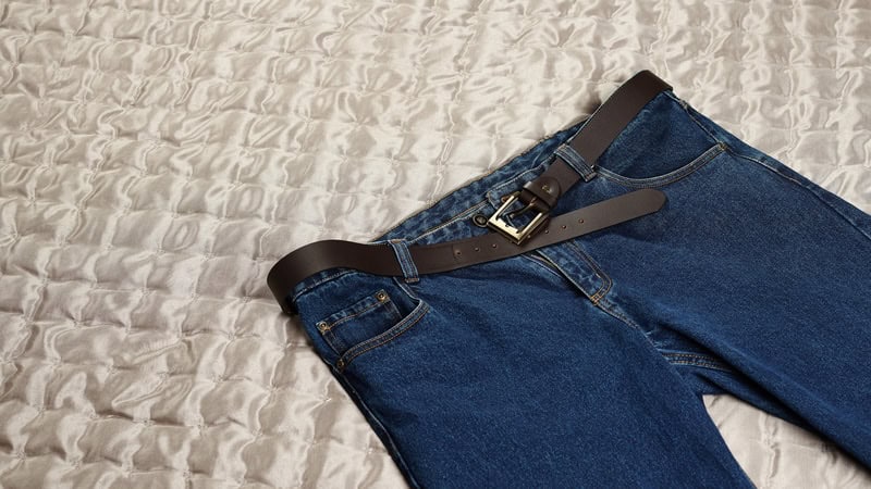 A pair of jeans lying on a bed. Image by Jarihin. "Forever in Blue Jeans"? Despite the classic Neil Diamond song, writer John Ficarra says, not so much.