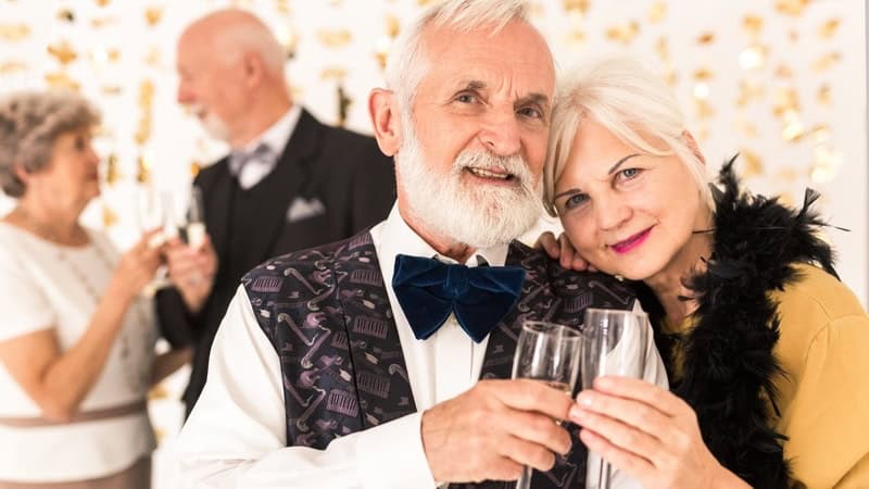 Senior couple at New Year's Eve party, for What's Booming December 26