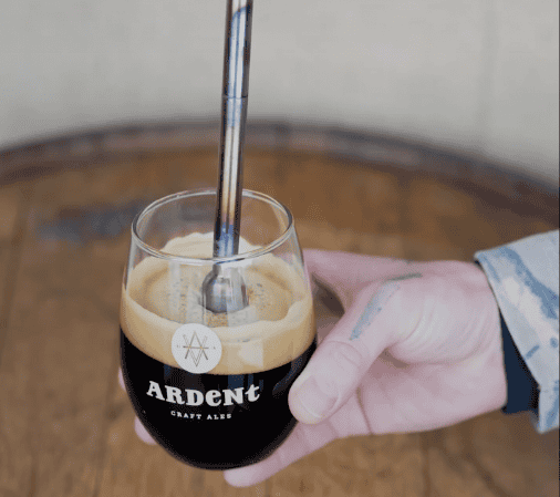 Bierstacheln: inserting a heated rod into a glass of beer in an Ardent Craft Ales glass. For a Feb. 1 event at Ardent.