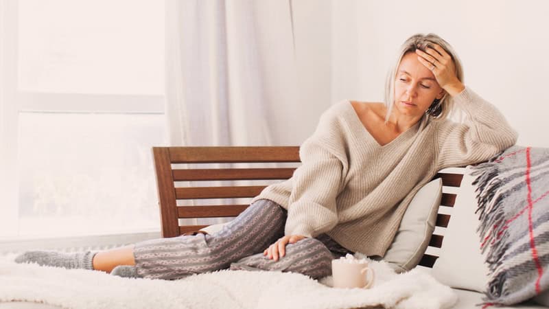 A middle-aged woman stressed from her responsibilities as a member of the sandwich generation. Image by Tatyana Gladskikh