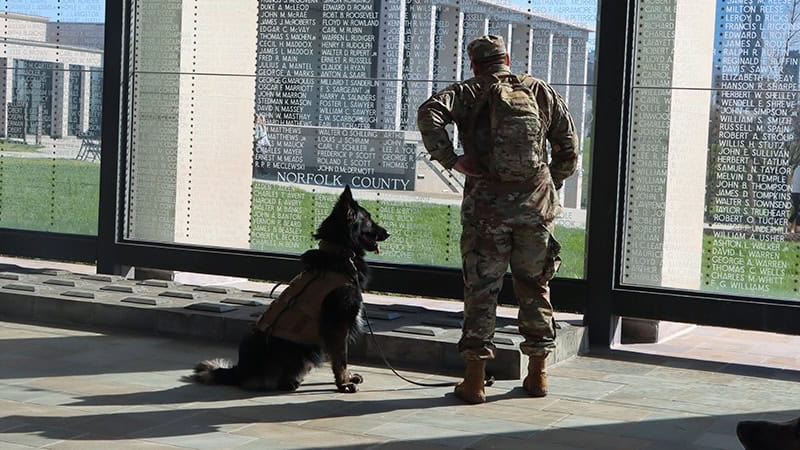 Military service dog and armed service owner at Virginia War Memorial