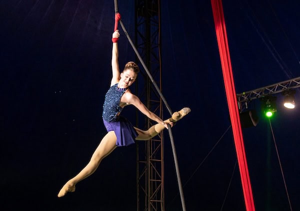 Woman swinging on a trapeze in Do Portugal Circus. Used in What's Booming March 6 to 13 to promote event, beginning on March 7 in Richmond, Va.